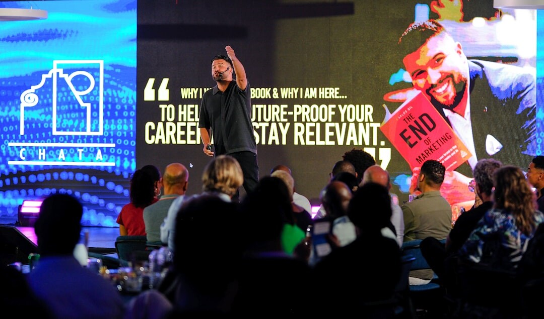 TV show host presenting confidently on stage in front of audience